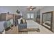 This is a spacious bedroom featuring a ceiling fan and soft, neutral decor at 5036 Sand Castle Dr, New Port Richey, FL 34652