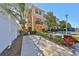 Townhouse exterior showcasing a well-maintained lawn and colorful landscaping at 5036 Sand Castle Dr, New Port Richey, FL 34652