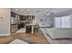 Modern kitchen and living area featuring a center island, stainless steel appliances, and comfortable seating at 5036 Sand Castle Dr, New Port Richey, FL 34652