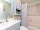 Bathroom featuring a modern vanity, shower-tub combo, with natural light and neutral tones at 5100 Burchette Rd # 500, Tampa, FL 33647
