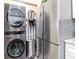 The laundry area includes an LG washer/dryer, stainless refrigerator, and extra storage shelves at 5100 Burchette Rd # 500, Tampa, FL 33647