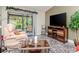 Relaxing living room with a cozy recliner and a view of the outdoor greenery at 5100 Burchette Rd # 500, Tampa, FL 33647