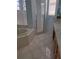 Bright bathroom with a walk-in shower, a tub, and tiled floors at 5261 Camberlea Ave, Zephyrhills, FL 33541