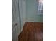 Bedroom with hardwood floors, closet, and a window at 5261 Camberlea Ave, Zephyrhills, FL 33541