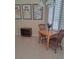 Cozy dining area with natural light from shuttered window and cheerful wall art at 5261 Camberlea Ave, Zephyrhills, FL 33541