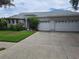 Charming single-story home featuring a two-car garage and well-maintained landscaping at 5261 Camberlea Ave, Zephyrhills, FL 33541