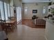 Bright living room with lots of light, hard floors, and tall ceilings at 5261 Camberlea Ave, Zephyrhills, FL 33541