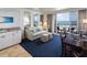 Lovely living room featuring an ocean view, a kitchenette, a dining table, and comfortable seating at 5500 Gulf Blvd # 4226, St Pete Beach, FL 33706