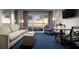 Comfortable living room with a sofa, dining area, and a balcony offering sunset ocean views at 5500 Gulf Blvd # 4226, St Pete Beach, FL 33706