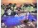 Aerial view of a large pool area surrounded by palm trees and seating at 5500 Gulf Blvd # 4226, St Pete Beach, FL 33706