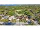 Aerial view of single Gathering home in a beautiful neighborhood with gorgeous green scenery and blue skies at 5938 Oakhurst Dr, Seminole, FL 33772