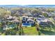 Aerial view of a backyard with a private pool, tropical landscaping, and a relaxing outdoor space at 5938 Oakhurst Dr, Seminole, FL 33772
