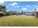 Expansive backyard with lush green lawn, perfect for outdoor activities and entertaining with room for pool at 5938 Oakhurst Dr, Seminole, FL 33772