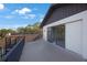 The balcony has a sleek black metal railing and glass sliding doors to allow for a beautiful view from inside at 5938 Oakhurst Dr, Seminole, FL 33772