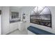 Bright bathroom featuring ample natural light, a vanity area, and white cabinets at 5938 Oakhurst Dr, Seminole, FL 33772