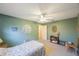 Green bedroom with furniture, doorway and neutral carpeting provides a relaxing space at 5938 Oakhurst Dr, Seminole, FL 33772