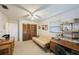 Bright bedroom with a futon, desk, closet, and neutral carpeting providing a versatile space at 5938 Oakhurst Dr, Seminole, FL 33772