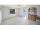 Bright bedroom with a window, closet, and neutral carpeting providing a serene space at 5938 Oakhurst Dr, Seminole, FL 33772