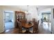 Inviting dining room features a large wood table, china cabinet, and chandelier at 5938 Oakhurst Dr, Seminole, FL 33772