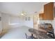 Open-concept living space with a breakfast bar and lots of sunlight, perfect for relaxing at 5938 Oakhurst Dr, Seminole, FL 33772