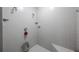 Bathroom featuring tiled floors, shower, with seat at 5938 Oakhurst Dr, Seminole, FL 33772