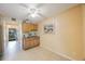 Additional view showcasing a breakfast bar with wood cabinetry, and a ceiling fan at 5938 Oakhurst Dr, Seminole, FL 33772