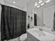 The bathroom offers a shower and tub combination and vanity at 6185 Hidden Branch Dr, Apollo Beach, FL 33572