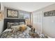 Bedroom features hardwood floors, a queen-sized bed, a window, and built-in storage at 6712 Runningwoods Dr, Tampa, FL 33634