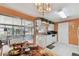 Bright dining area with a view to the sunroom, showcasing a cozy table setting and ample natural light at 6712 Runningwoods Dr, Tampa, FL 33634