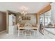 Charming dining area featuring a classic table set with decorative plates and artwork, perfect for Gathering meals at 6712 Runningwoods Dr, Tampa, FL 33634