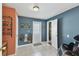 Hallway view with tile flooring and light fixture at 6712 Runningwoods Dr, Tampa, FL 33634
