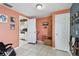 Hallway view of access to the kitchen with tile flooring, and painted walls at 6712 Runningwoods Dr, Tampa, FL 33634