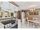 Open-concept kitchen featuring modern appliances, and an eat-in dining area, perfect for gatherings at 6712 Runningwoods Dr, Tampa, FL 33634