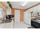 Bright kitchen featuring white cabinets, tile floors, and modern appliances, offering a welcoming space at 6712 Runningwoods Dr, Tampa, FL 33634