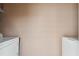 The laundry room features a pale colored block wall with white washer and dryer at 6712 Runningwoods Dr, Tampa, FL 33634