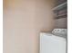The laundry room features a pale colored block wall with a white washer at 6712 Runningwoods Dr, Tampa, FL 33634