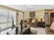 Inviting living room featuring a comfortable sofa, stylish decor, and lots of natural light at 6712 Runningwoods Dr, Tampa, FL 33634