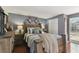 Comfortable bedroom with a rustic wooden bed frame, stylish decor, and warm lighting for a relaxing ambiance at 6712 Runningwoods Dr, Tampa, FL 33634