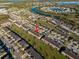 An aerial view of townhomes with well-maintained lawns and convenient parking at 7047 Towne Lake Rd, Riverview, FL 33578