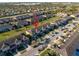 A high aerial shot of townhomes with tidy lawns and ample parking at 7047 Towne Lake Rd, Riverview, FL 33578