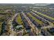 Community aerial view showcasing the layout, nearby road access, and community pool at 7047 Towne Lake Rd, Riverview, FL 33578