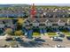 An aerial view of a tan townhome with an attached garage and beautifully maintained lawns at 7047 Towne Lake Rd, Riverview, FL 33578