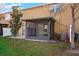 View of backyard showcasing a screened lanai and green space at 7047 Towne Lake Rd, Riverview, FL 33578