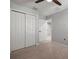 Spacious bedroom featuring a ceiling fan, neutral carpet and a walk in closet at 7047 Towne Lake Rd, Riverview, FL 33578