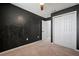 This bedroom features neutral carpet, a ceiling fan and a closet at 7047 Towne Lake Rd, Riverview, FL 33578