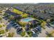 Aerial shot of a community pool and clubhouse surrounded by lush landscaping at 7047 Towne Lake Rd, Riverview, FL 33578
