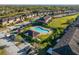 A community pool surrounded by beautiful landscaping and mature trees plus ample parking at 7047 Towne Lake Rd, Riverview, FL 33578