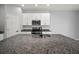 Bright kitchen featuring a central island with a stainless steel sink and faucet at 7047 Towne Lake Rd, Riverview, FL 33578