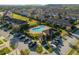 Aerial view of community pool, cabana, visitor parking and lush landscaping, ideal for relaxed living at 7047 Towne Lake Rd, Riverview, FL 33578