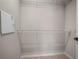 Walk-in closet with shelving for storing clothes and personal items at 7047 Towne Lake Rd, Riverview, FL 33578